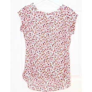 Floral print cap sleeve scoop neck blouse.